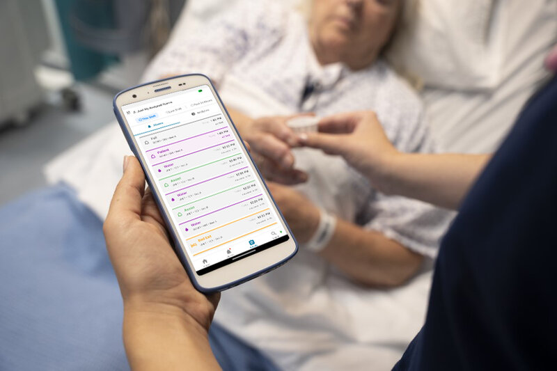 Clinician using Alairo platform at patient bedside